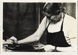 Title: ANU Christmas card, inking a plate | Date: 1976 | Technique: gelatin-silver print; handwritten inscription in black and blue ink